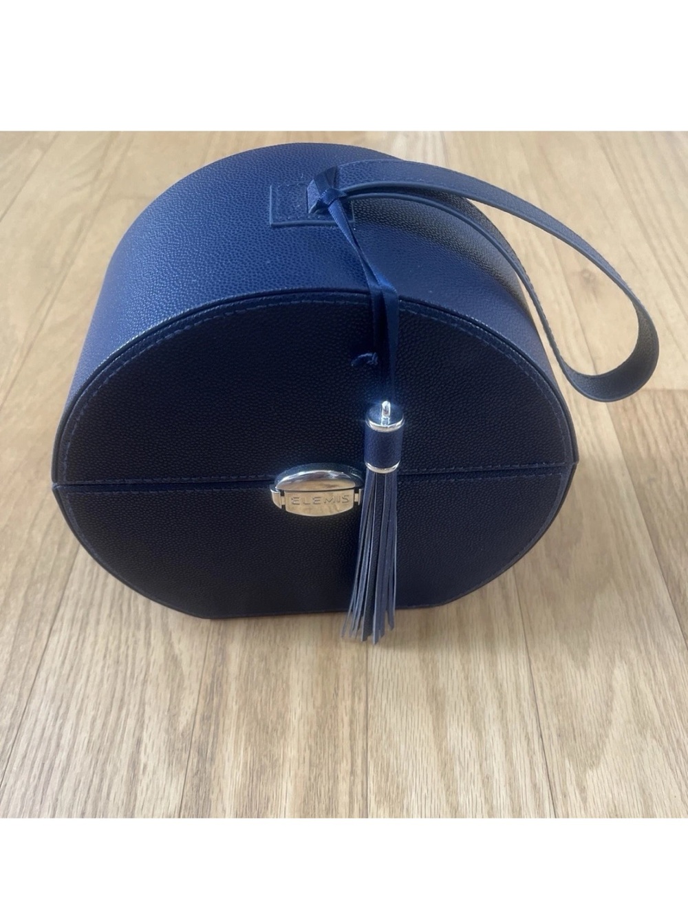 ELEMIS Navy Round Hard makeup/travel case with push lock closure & Tassel